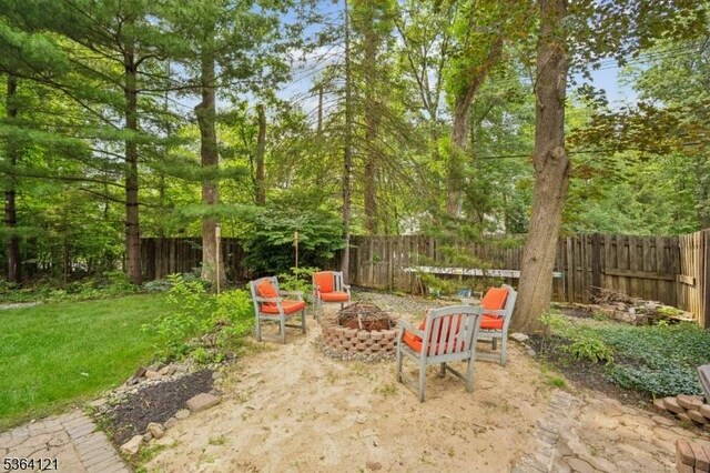 198 Pittsford Way, New Providence Boro, NJ 07974 - fenced backyard featuring a fire pit and a patio