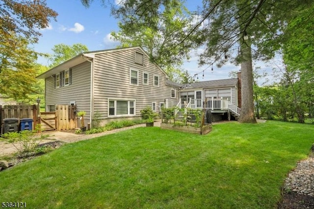 198 Pittsford Way, New Providence Boro, NJ 07974 - rear view of house with a garden, a wooden deck, and a gate