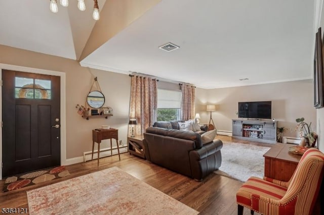 198 Pittsford Way, New Providence Boro, NJ 07974 - living area featuring baseboard heating, wood finished floors, and ornamental molding