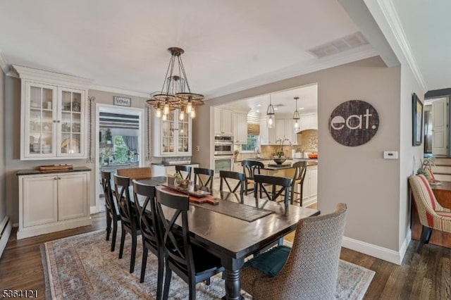 198 Pittsford Way, New Providence Boro, NJ 07974 - dining room with dark wood finished floors, a chandelier, and crown molding