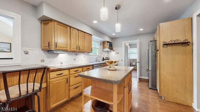 505 Sheppard Ct, Hillsborough Twp, NJ 08844 - kitchen featuring open shelves, appliances with stainless steel finishes, a center island, light wood-style floors, and tasteful backsplash