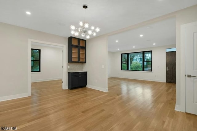 21 W Cliff St, Somerville Boro, NJ 08876 - unfurnished living room featuring light wood-style floors, a chandelier, and recessed lighting