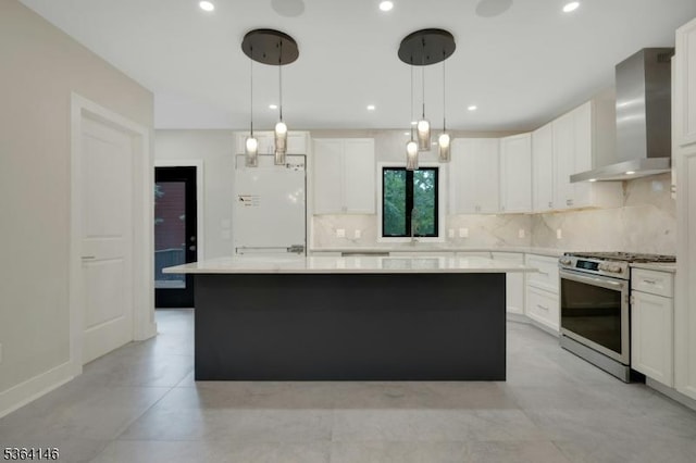 21 W Cliff St, Somerville Boro, NJ 08876 - kitchen featuring stainless steel range with gas stovetop, wall chimney range hood, backsplash, a center island, and light countertops