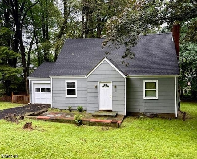 39 Woodcrest Rd, Parsippany-Troy Hills Twp, NJ 07005 - view of front of home featuring a chimney, a front yard, a garage, and a shingled roof