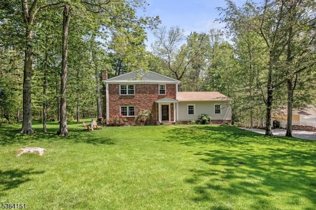 37 Dogwood Dr, Chester Twp, NJ 07930 - view of front of house featuring a chimney, a front lawn, and brick siding