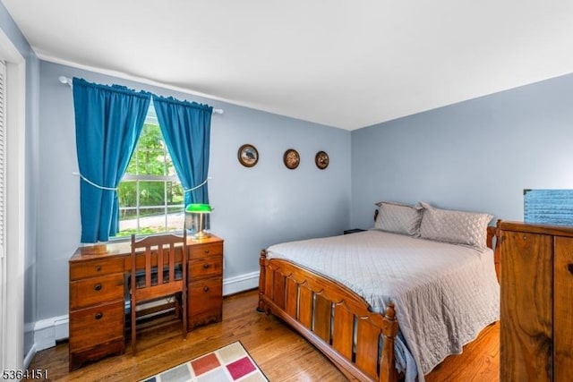 37 Dogwood Dr, Chester Twp, NJ 07930 - bedroom with light wood-style floors and a baseboard radiator