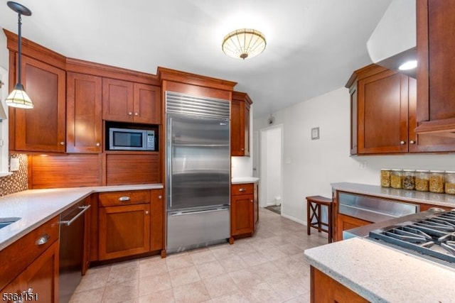 37 Dogwood Dr, Chester Twp, NJ 07930 - kitchen featuring built in appliances, decorative backsplash, light countertops, and hanging light fixtures