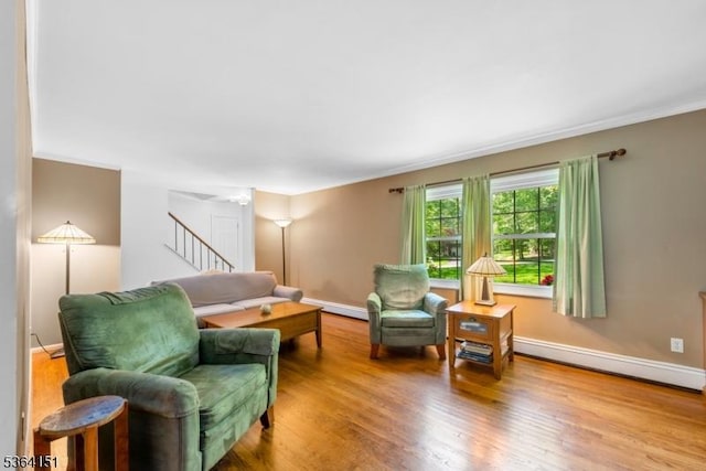 37 Dogwood Dr, Chester Twp, NJ 07930 - living area with a baseboard heating unit, wood finished floors, crown molding, stairs, and baseboard heating