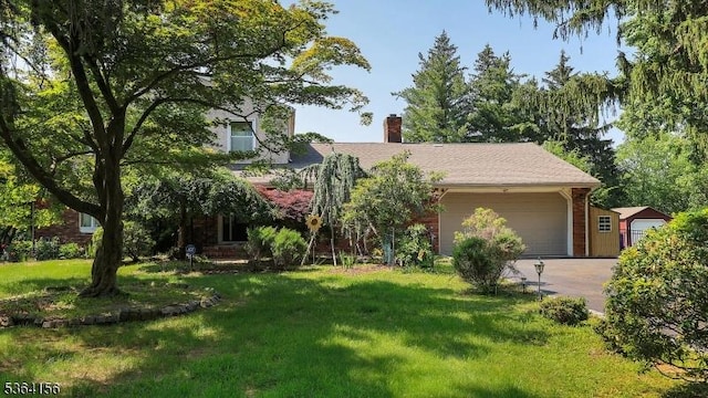 165 Rock Rd W, Green Brook Twp, NJ 08812 - obstructed view of property featuring an attached garage, a front yard, driveway, and a chimney