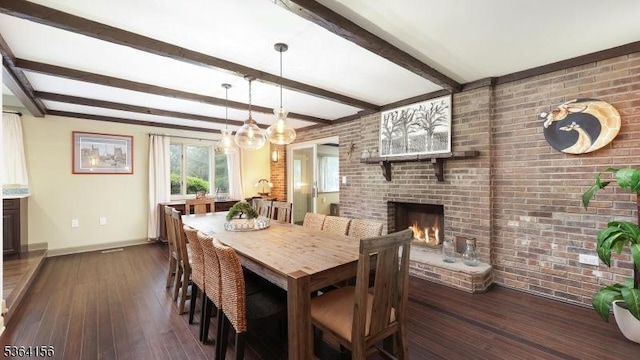 165 Rock Rd W, Green Brook Twp, NJ 08812 - dining space with hardwood / wood-style flooring, brick wall, a fireplace, beam ceiling, and a chandelier