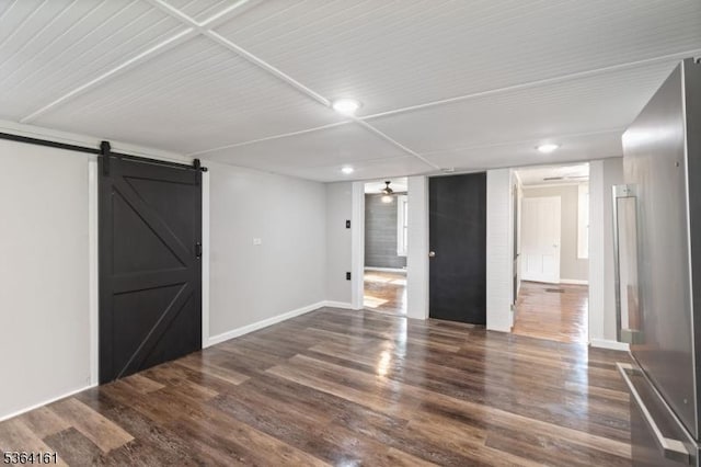 132 Axford Ave, Oxford Twp, NJ 07863 - below grade area featuring stainless steel refrigerator, recessed lighting, a barn door, dark wood-style flooring, and baseboards