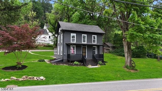132 Axford Ave, Oxford Twp, NJ 07863 - view of front of house with a porch, a front lawn, and view of wooded area