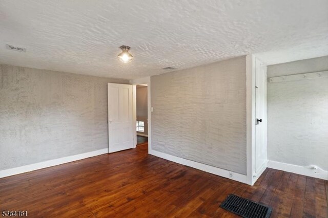 132 Axford Ave, Oxford Twp, NJ 07863 - empty room featuring baseboards, wood-type flooring, and a textured ceiling
