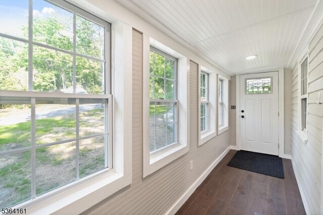 132 Axford Ave, Oxford Twp, NJ 07863 - unfurnished sunroom featuring baseboards, hardwood / wood-style floors, and healthy amount of natural light