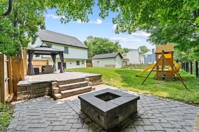 29 Tennis Rd, Jefferson Twp, NJ 07849 - fenced backyard with a patio, an outdoor fire pit, a playground, a gazebo, and a residential view