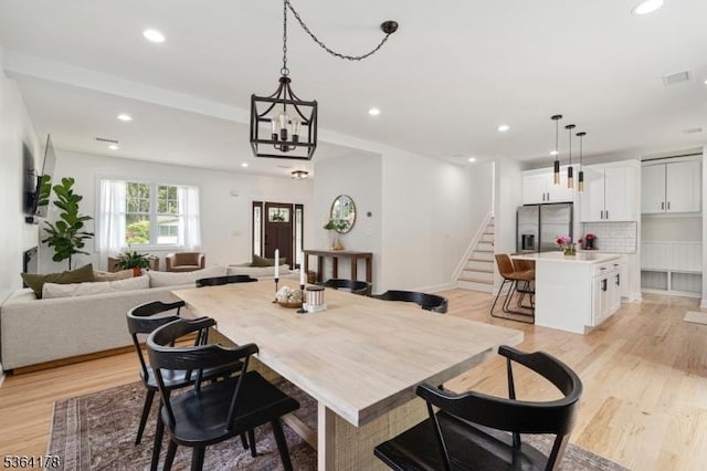 29 Tennis Rd, Jefferson Twp, NJ 07849 - dining room featuring light wood-style flooring, stairway, and recessed lighting