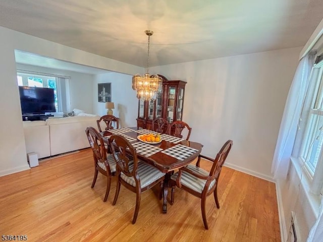 23 Bogle Ave, North Arlington Boro, NJ 07031 - dining space with light wood-style flooring and a chandelier