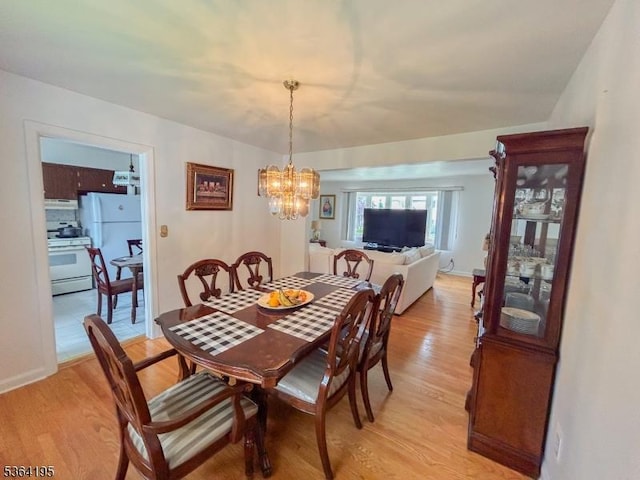 23 Bogle Ave, North Arlington Boro, NJ 07031 - dining room featuring light wood-style floors and a chandelier