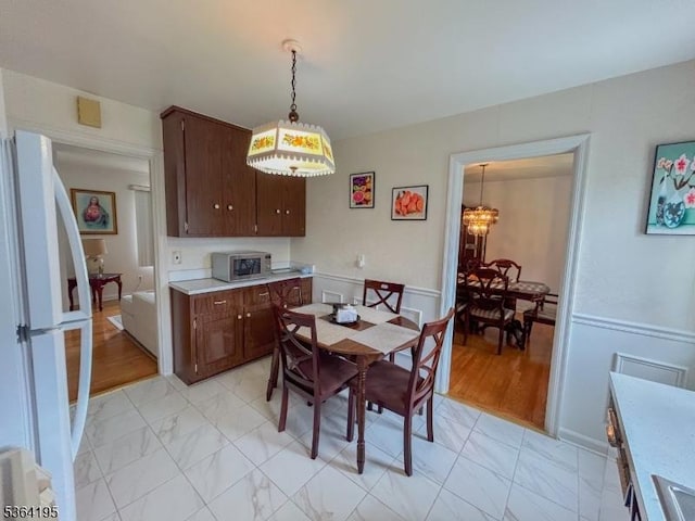 23 Bogle Ave, North Arlington Boro, NJ 07031 - dining area with a chandelier and light marble finish floors