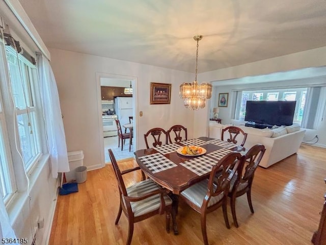 23 Bogle Ave, North Arlington Boro, NJ 07031 - dining space with light wood-style floors and a chandelier