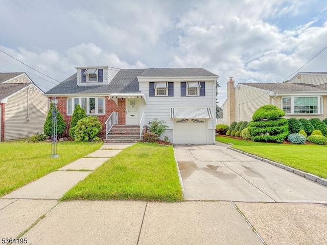 23 Bogle Ave, North Arlington Boro, NJ 07031 - tri-level home featuring concrete driveway, a front yard, an attached garage, brick siding, and roof with shingles