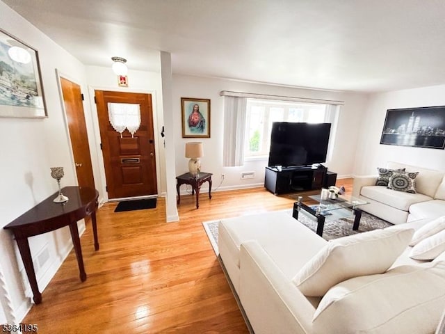 23 Bogle Ave, North Arlington Boro, NJ 07031 - living room with light wood finished floors and baseboards