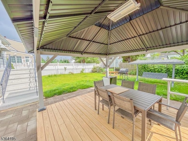 23 Bogle Ave, North Arlington Boro, NJ 07031 - wooden deck featuring outdoor dining space, a fenced backyard, a gazebo, and stairway