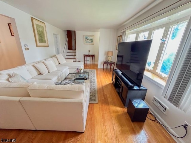 23 Bogle Ave, North Arlington Boro, NJ 07031 - living room with light wood finished floors and stairs