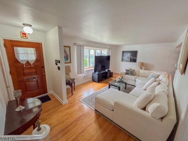 23 Bogle Ave, North Arlington Boro, NJ 07031 - living room with light wood finished floors and baseboards