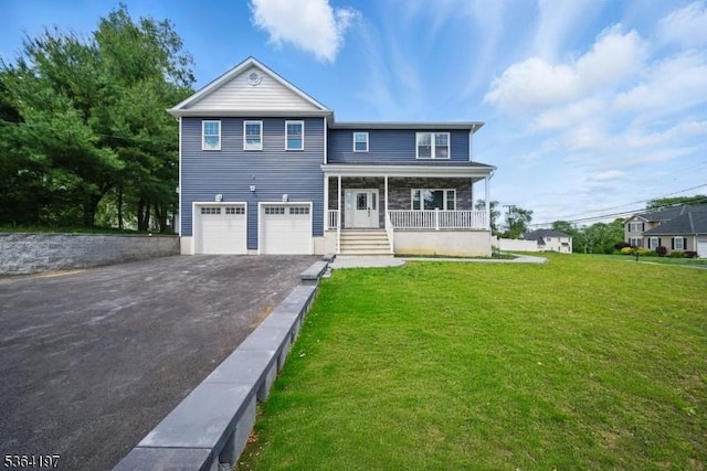 181 Randolph Ave, Mine Hill Twp, NJ 07803 - view of front of home with asphalt driveway, covered porch, a garage, and a front lawn