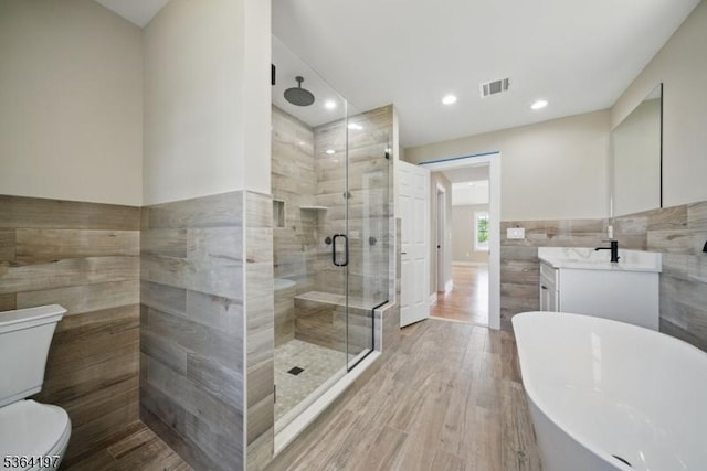 181 Randolph Ave, Mine Hill Twp, NJ 07803 - full bath with tile walls, a freestanding tub, a stall shower, vanity, and wood finished floors