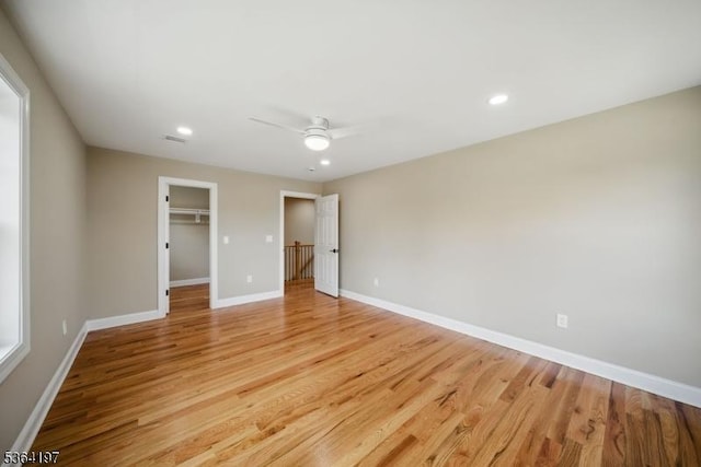 181 Randolph Ave, Mine Hill Twp, NJ 07803 - unfurnished bedroom featuring light wood-style floors, recessed lighting, a walk in closet, ceiling fan, and a closet