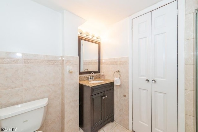 11 Putters Rd, Roxbury Twp, NJ 07876 - full bath with tile walls, a closet, vanity, wainscoting, and tile patterned floors