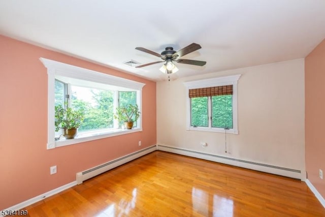 11 Putters Rd, Roxbury Twp, NJ 07876 - spare room with baseboard heating, wood finished floors, and ceiling fan