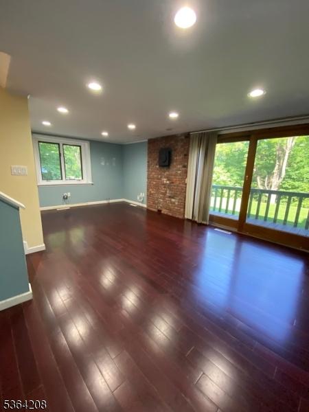 9 Village Way Unit B5, Vernon Twp, NJ 07462 - unfurnished living room with hardwood / wood-style floors and recessed lighting