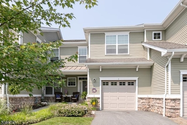 3 Indigo Rd, Allamuchy Twp, NJ 07840 - view of front of property with an attached garage, stone siding, and asphalt driveway