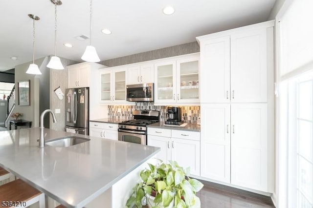 3 Indigo Rd, Allamuchy Twp, NJ 07840 - kitchen featuring appliances with stainless steel finishes, a kitchen island with sink, recessed lighting, backsplash, and white cabinetry
