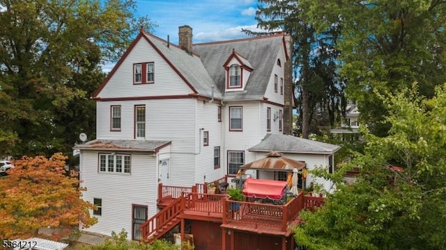 129 S Munn Ave, East Orange City, NJ 07018 - back of property featuring a gazebo, a deck, a chimney, and stairs