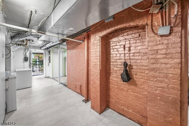 129 S Munn Ave, East Orange City, NJ 07018 - basement featuring brick wall and refrigerator