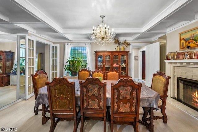 129 S Munn Ave, East Orange City, NJ 07018 - dining room featuring a chandelier, coffered ceiling, light wood-style floors, beamed ceiling, and a glass covered fireplace