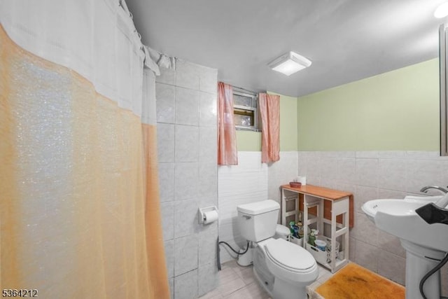 129 S Munn Ave, East Orange City, NJ 07018 - full bath with tile walls, wainscoting, and a shower with curtain