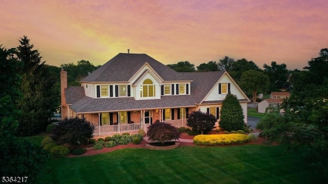 74 Oxford Pl, Hillsborough Twp, NJ 08844 - view of front of home with a porch, a chimney, and a front lawn
