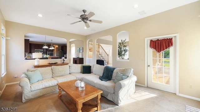 74 Oxford Pl, Hillsborough Twp, NJ 08844 - living area featuring arched walkways, light carpet, stairs, a ceiling fan, and recessed lighting