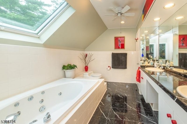 25 Mordaunt Rd, Vernon Twp, NJ 07462 - full bath with tile walls, a tub with jets, double vanity, ceiling fan, and a skylight