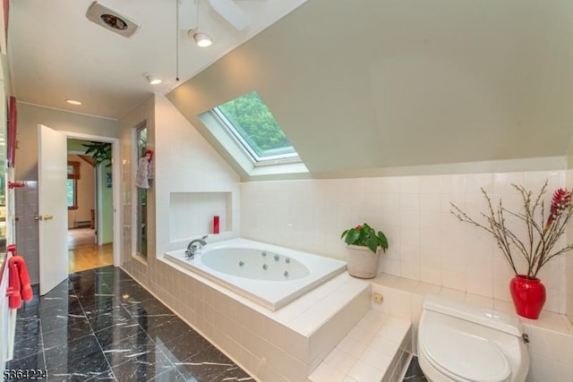 25 Mordaunt Rd, Vernon Twp, NJ 07462 - full bathroom with a skylight, a whirlpool tub, marble finish floors, and lofted ceiling