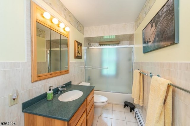 25 Mordaunt Rd, Vernon Twp, NJ 07462 - full bath with tile walls, vanity, tile patterned floors, a baseboard radiator, and enclosed tub / shower combo