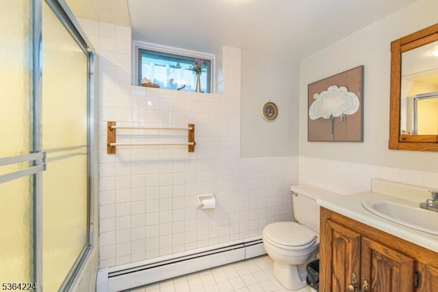 25 Mordaunt Rd, Vernon Twp, NJ 07462 - full bathroom featuring baseboard heating, tile walls, a shower with door, tile patterned floors, and vanity