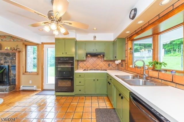 25 Mordaunt Rd, Vernon Twp, NJ 07462 - kitchen featuring green cabinetry, dishwasher, baseboard heating, stainless steel gas cooktop, and plenty of natural light