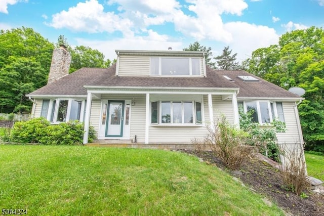 25 Mordaunt Rd, Vernon Twp, NJ 07462 - view of front facade featuring a front lawn, a chimney, roof with shingles, and a porch