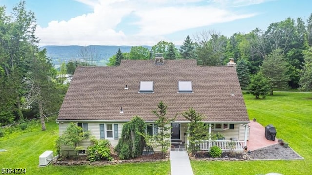 25 Mordaunt Rd, Vernon Twp, NJ 07462 - view of front facade featuring a porch, a front yard, and roof with shingles
